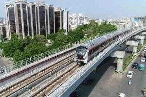 Mumbai Metro elevated train running past residential towers