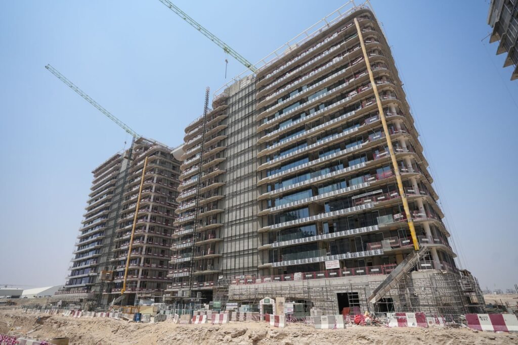Azizi Venice buildings during facade works, September 2026