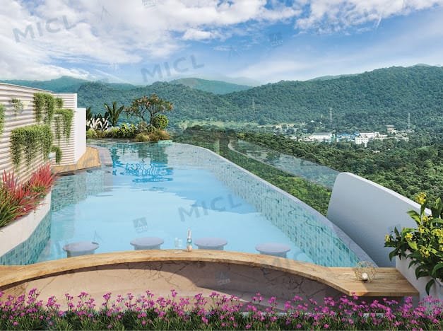 Rooftop infinity pool at MICL Aaradhya Parkwood overlooking the national park