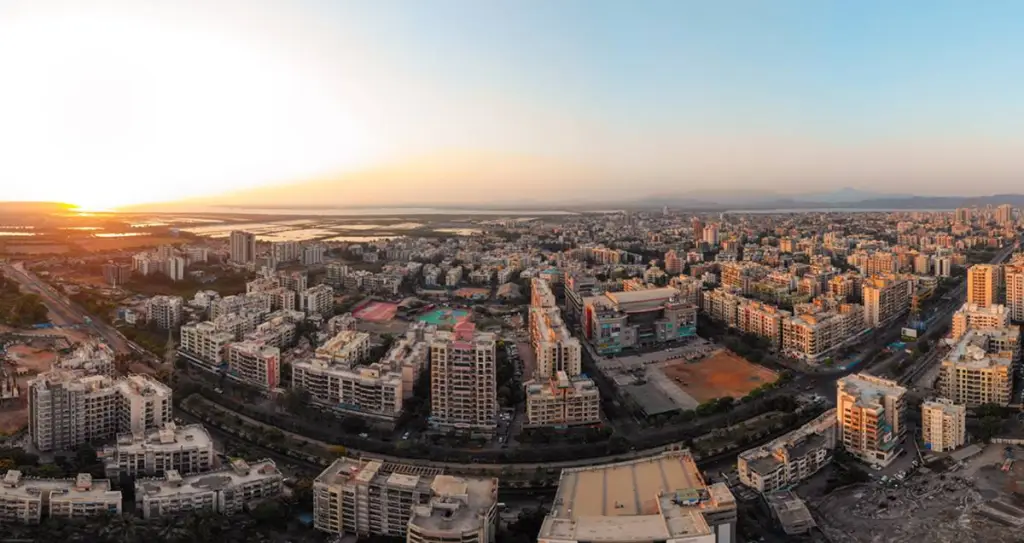 Aerial panorama of Mira Road's residential skyline at sunset