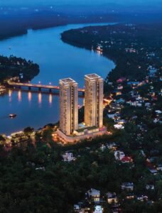 SOBHA Bellevue Kozhikode towers at night by the river