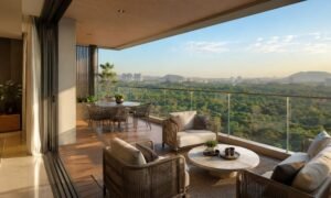 One Hills living room opening onto a deck with green views (artist’s impression)