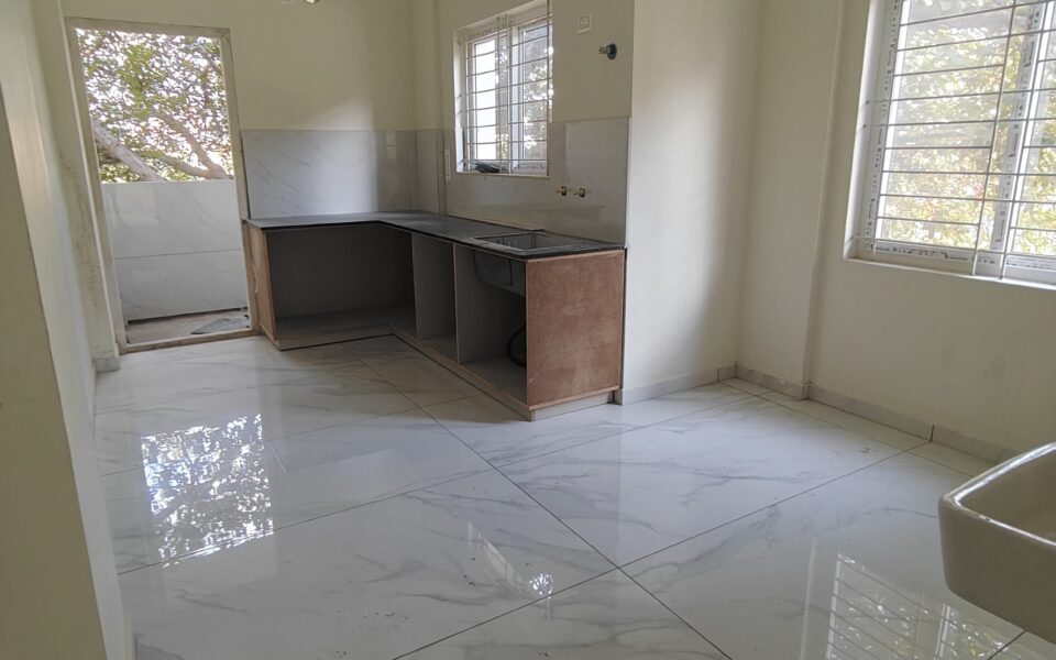 Spacious living room in a 2 BHK apartment at Shreevari Sannidhi